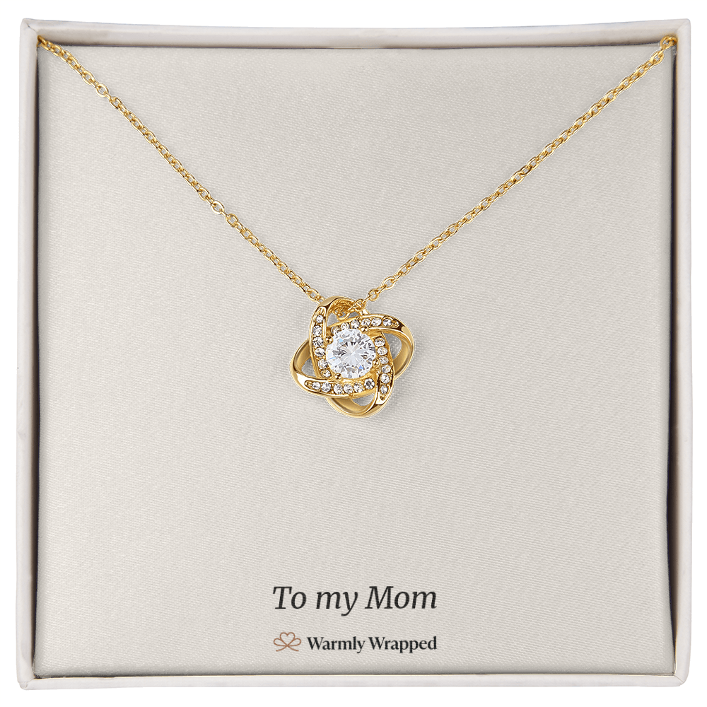 What arrives: the love knot necklace on its printed “To my Mom” card