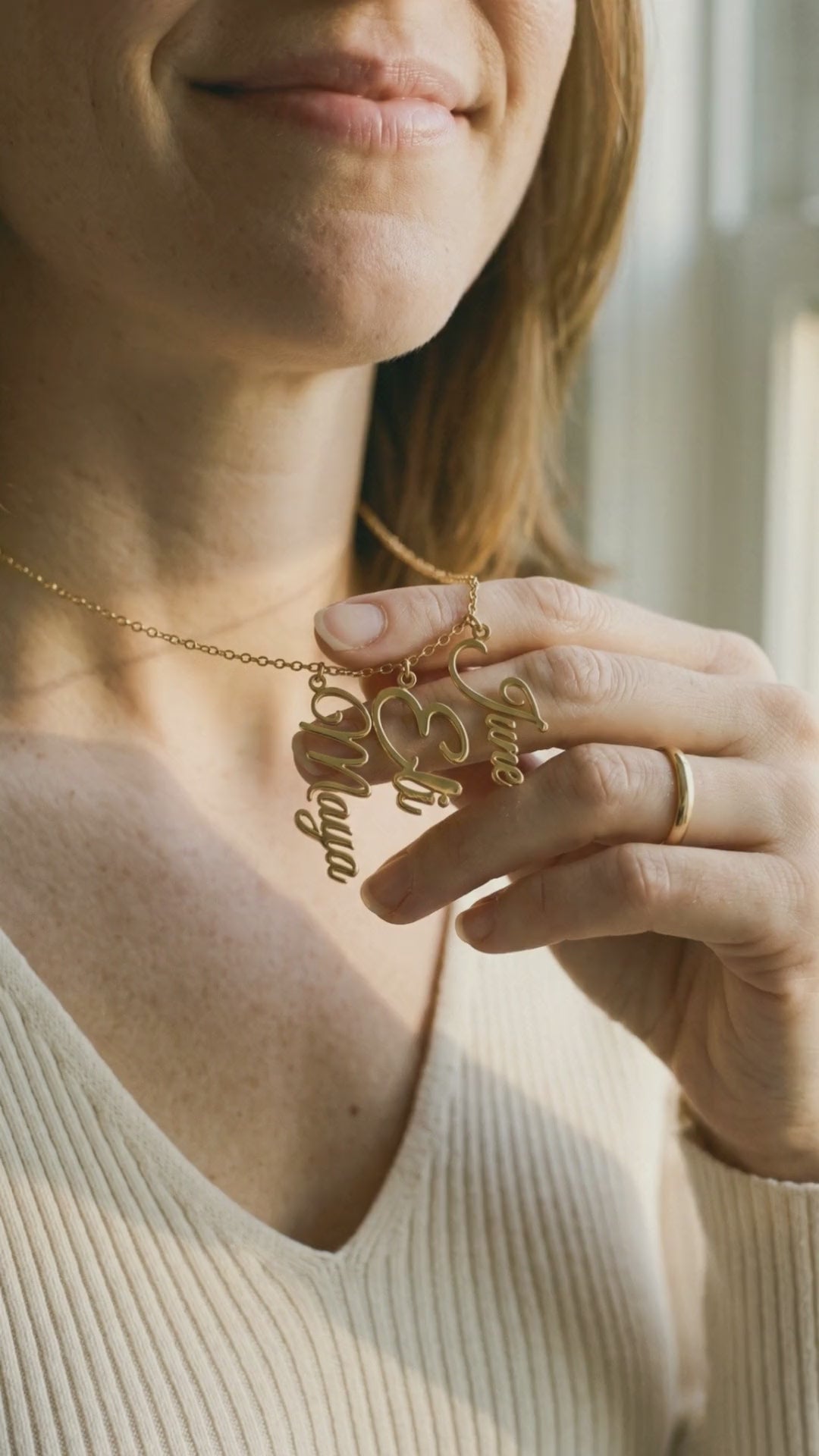 Video: close-up of the gold names Maya, Eli and June catching the light