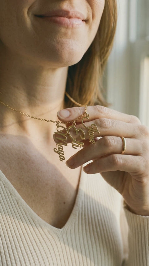 Video: close-up of the gold names Maya, Eli and June catching the light