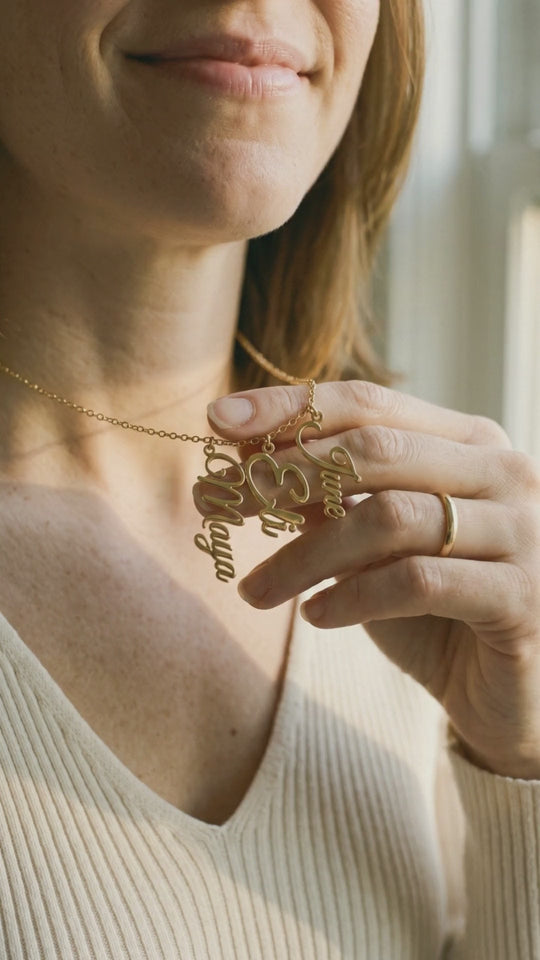 Video: close-up of the gold names Maya, Eli and June catching the light