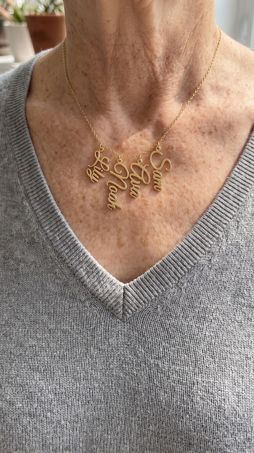 Grandma necklace with grandkids names, worn