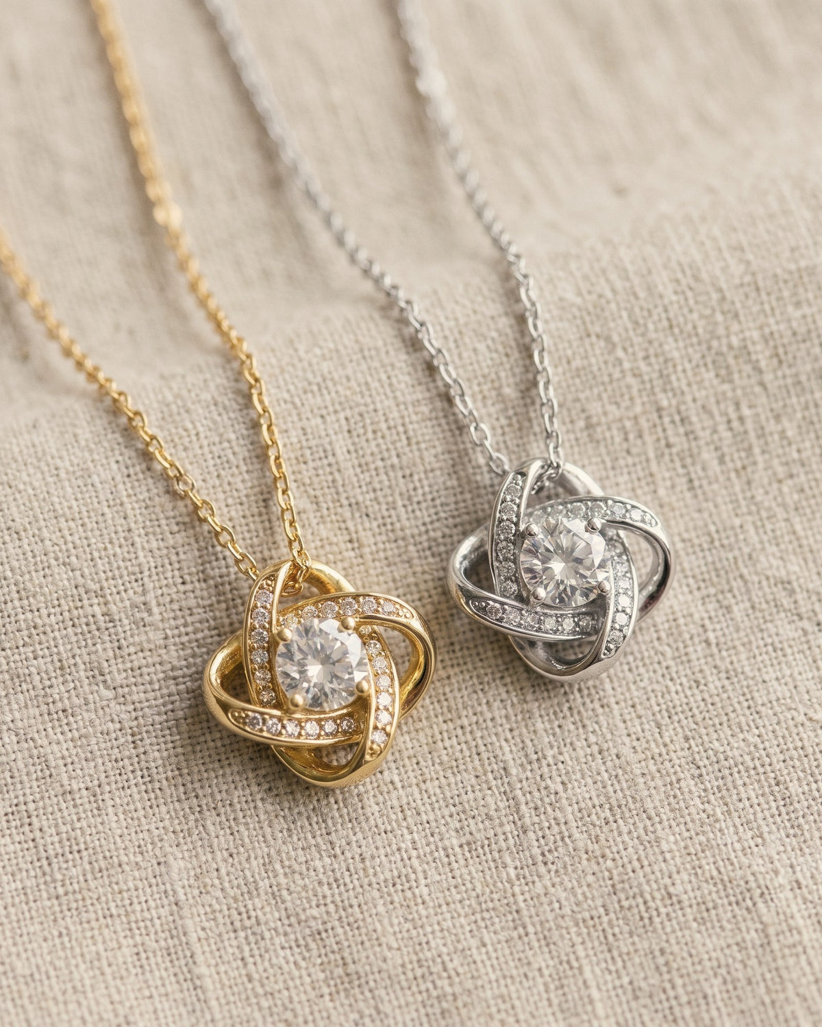 The love knot necklace in yellow gold tone and white gold tone
